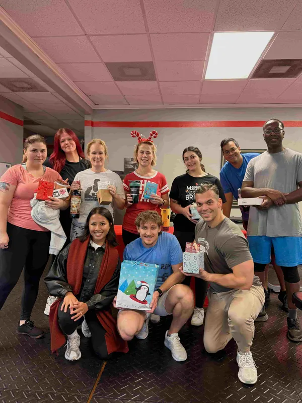 Heroes Fitness clients and coaches at the studio's Christmas workout and gift exchange